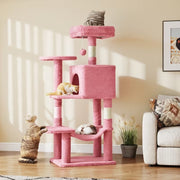 Pink cat tree shown in a living room